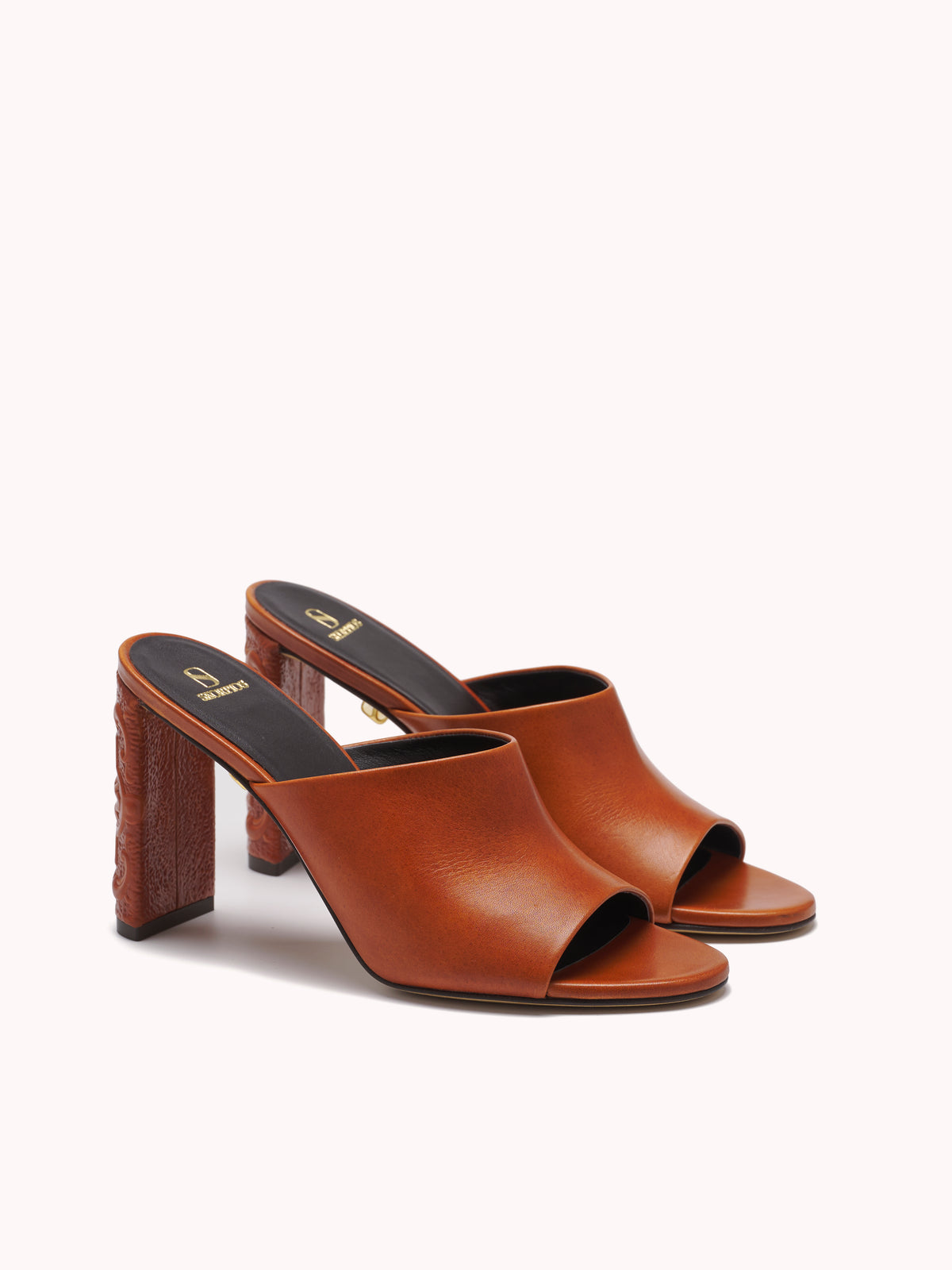 Designer mules in brown leather and embossed heels maison skorpios by adriana abascal emanuele filiberto