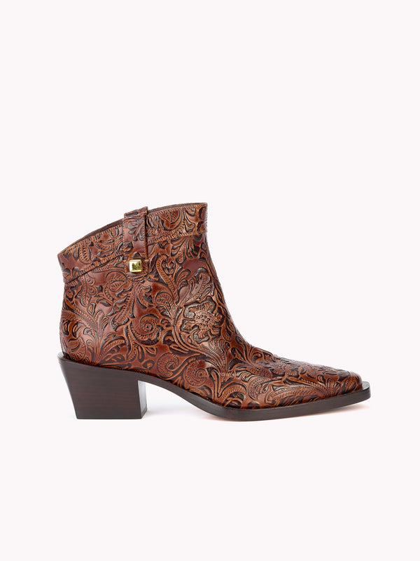 Brown embossed leather santiag boots made in italy by Adriana Abascal Clotilde Courau Emanuele di Savoia