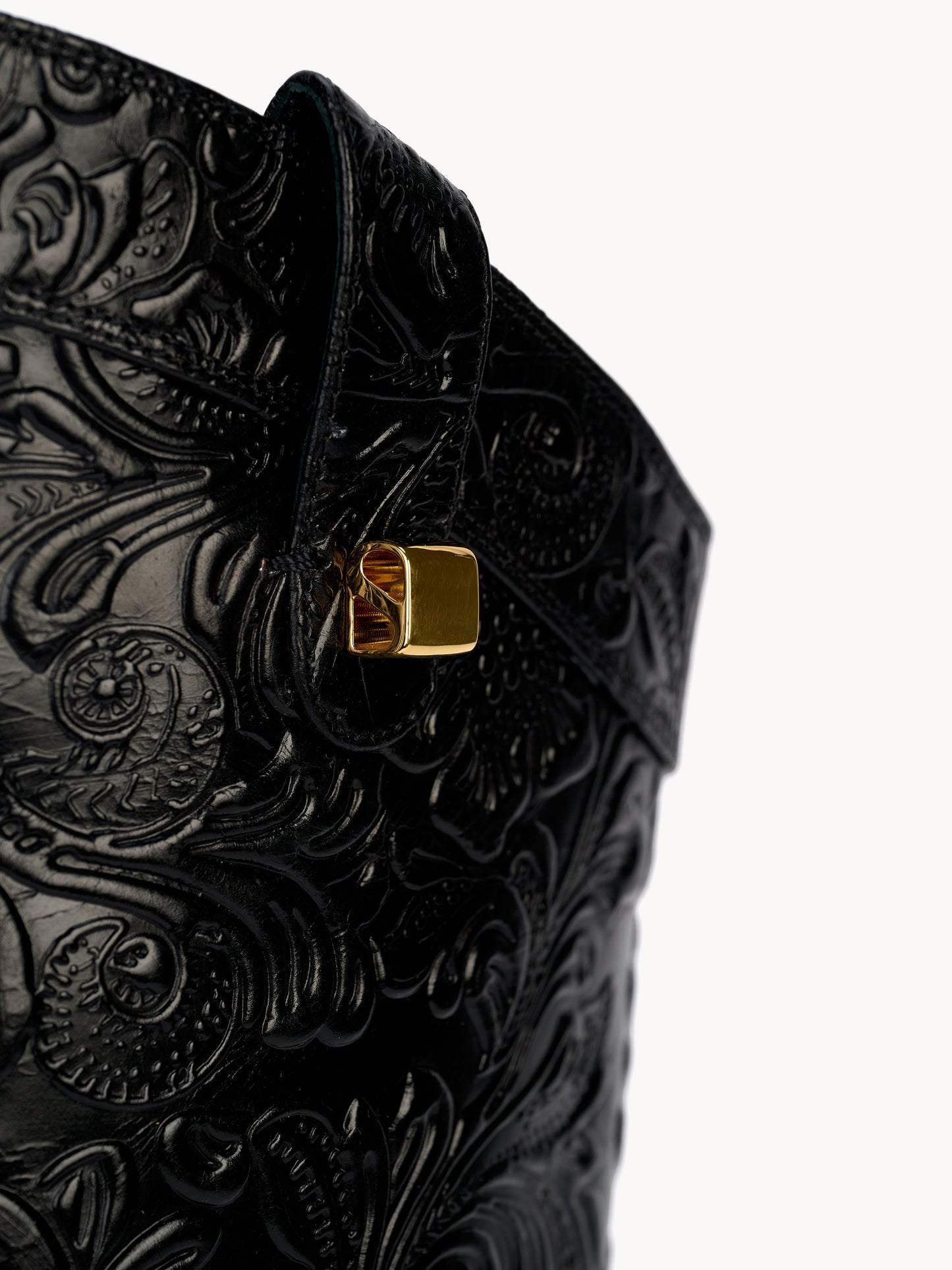 Designer west boots in black embossed leather with floral patterns by Adriana Abascal Emanuele di Savoia