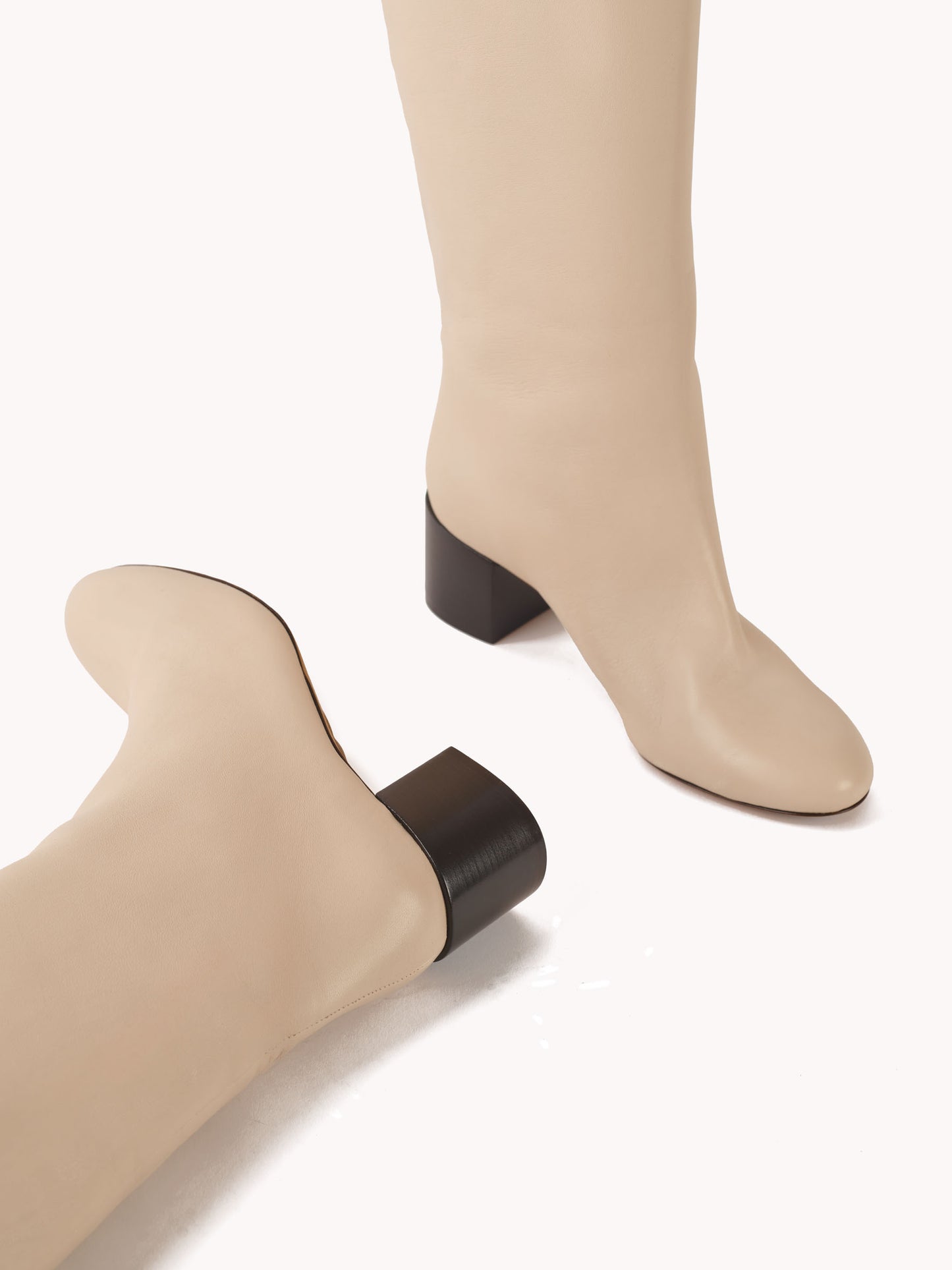 mid heel luxury boots in white leather maison skorpios by adriana abascal emanuele filiberto