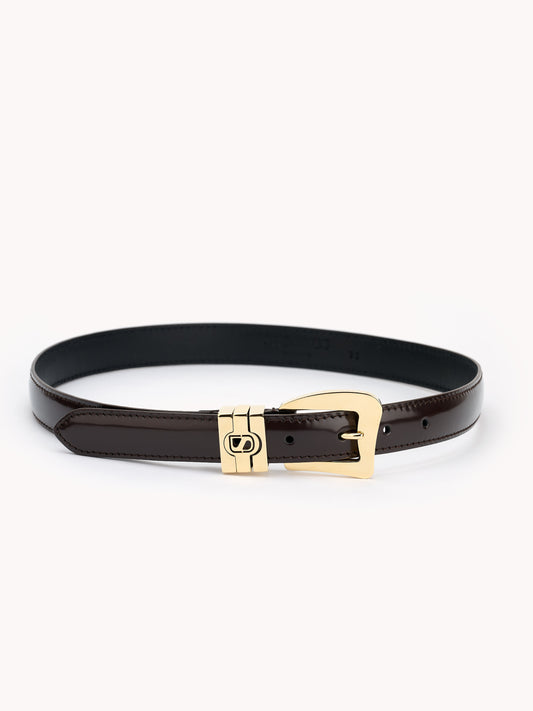 glossy brown belt luxury materials Maison Skorpios by Adriana Abascal