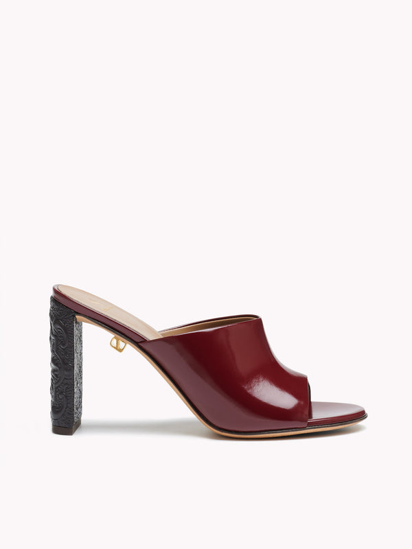 Patent burgundy leather mules for women Maison Skorpios by Adriana Abascal