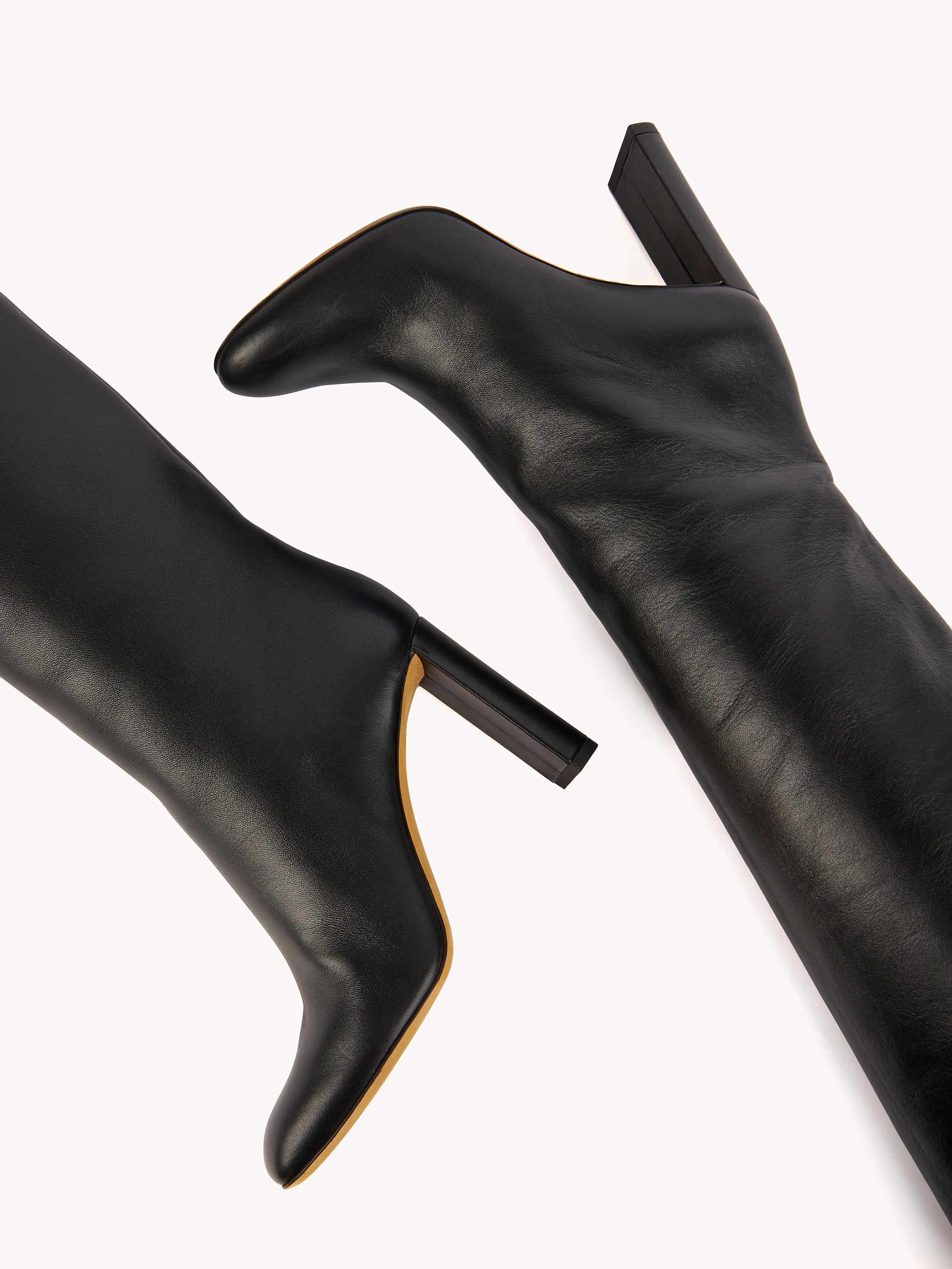 sophisticated black leather boots with comfortable high heels maison skorpios by adriana abascal emanuele filiberto di Savoia