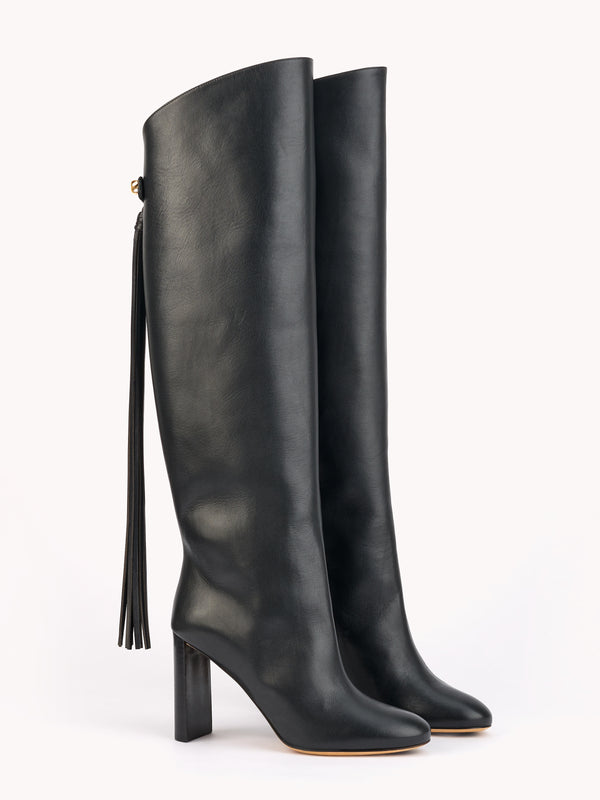 sophisticated luxury equestrian high boots in black leather with removable strap skorpios