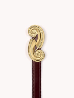 Original luxury belt for women made in shiny burgundy calf leather and feather gold brass buckle Maison Skorpios by Adriana Abascal