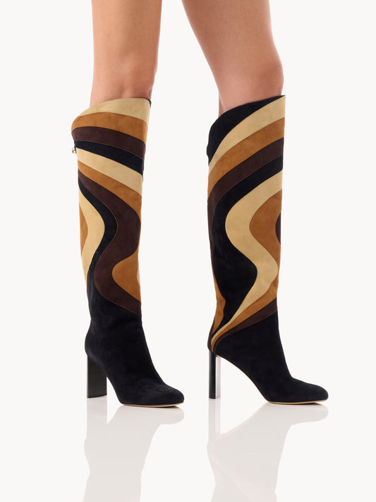 Trendy designer patchwork boots by Adriana Abascal Filiberto de Saboya