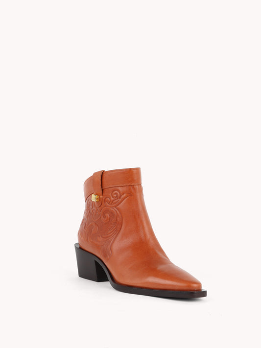 elegant santiag brown embossed leather low boots maison skorpios by adriana abascal Filiberto de Saboya
