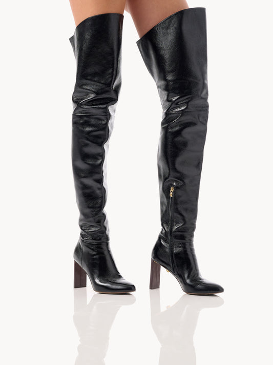 extravagant thigh high boots in black patent grained leather made in Italy by Adriana Abascal
