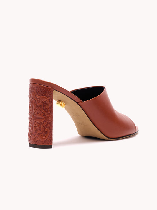 Luxury brown mules in leather with embossed heels maison skorpios by adriana abascal emanuele filiberto