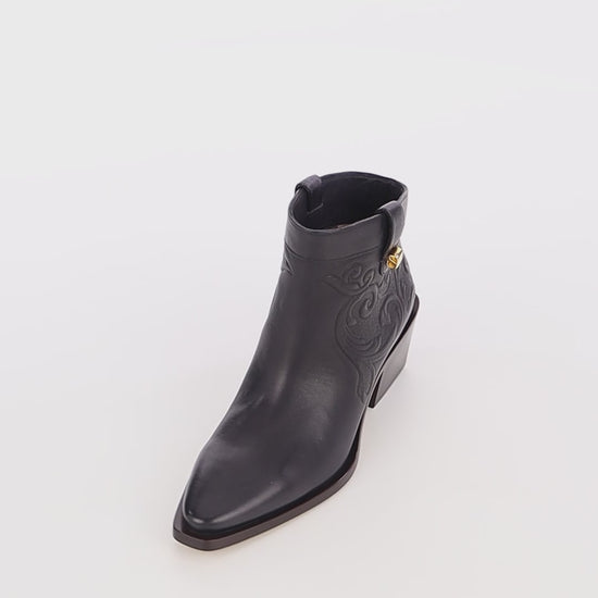 trendy modern low boots black embossed leather maison skorpios by adriana abascal Filiberto de Saboya