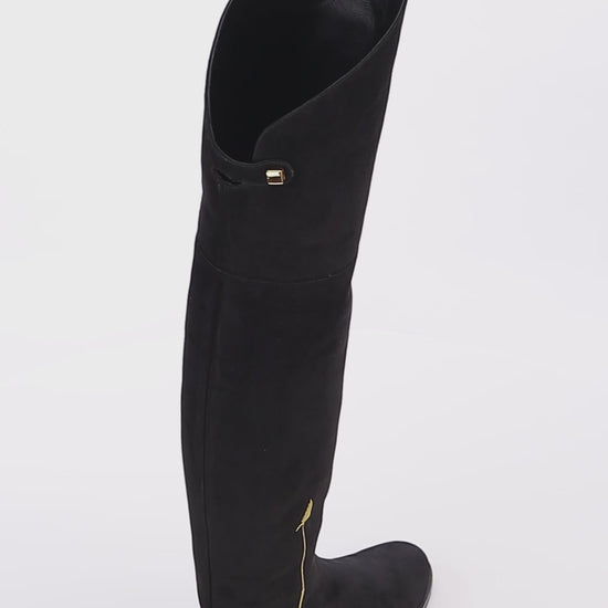 trendy black suede over the knee flat boots with embroidered gold arrow skorpios