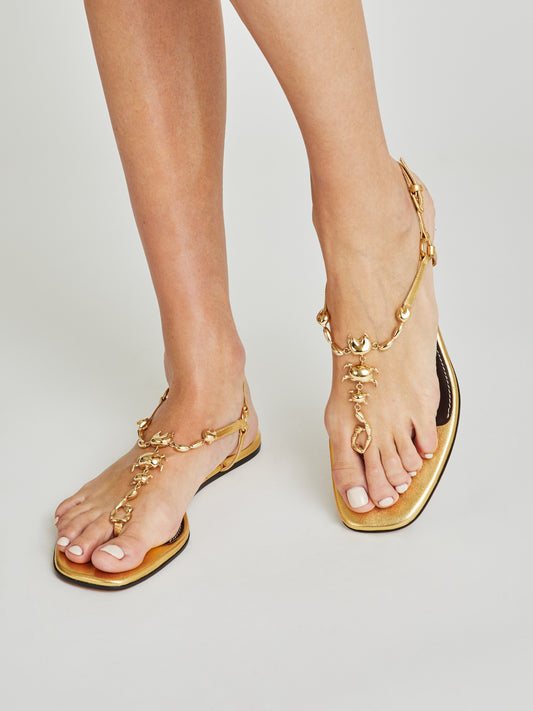 luxury flat sandals in metallic gold nappa leather, scorpio adjustable ankle strap maison skorpios by adriana abascal emanuele filiberto di Savoia 